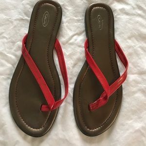 Red ‘leather’ flip flops